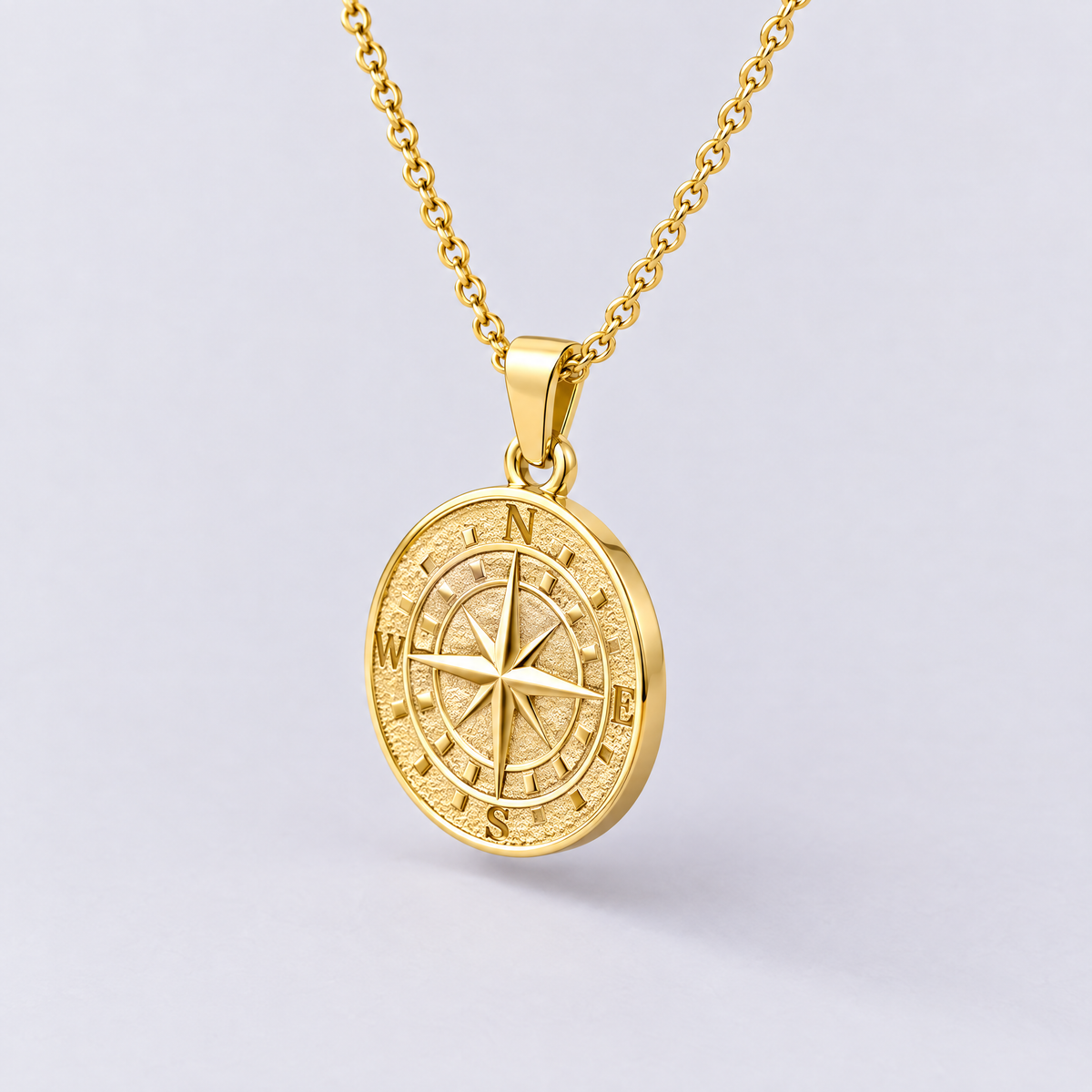 Gold compass pendant necklace side view